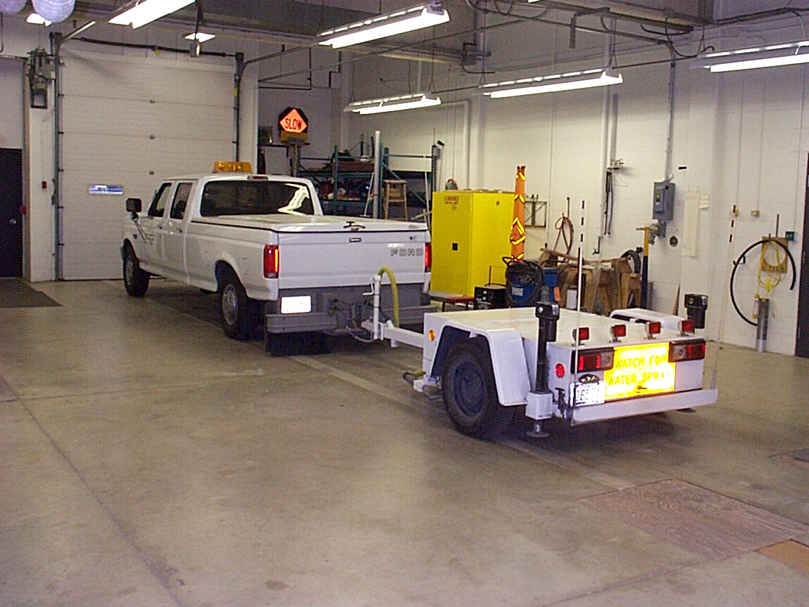 Friction skid resistance testing trailer hitched to truck