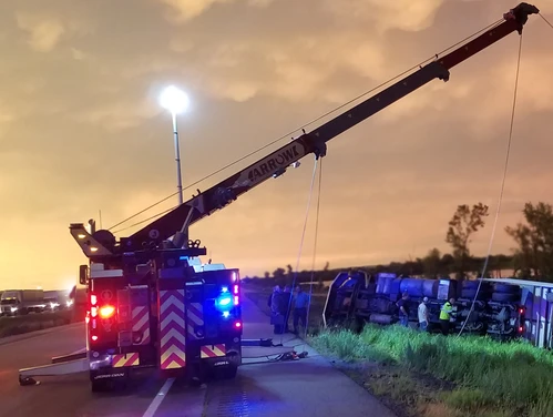 Tow truck getting semi out of ditch