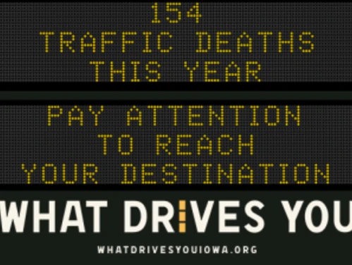 Traffic roadside graphic with text of the news article title.