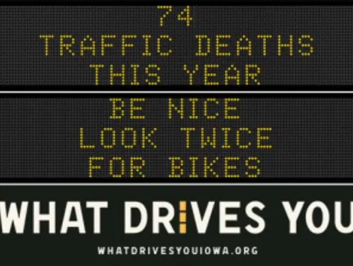 Traffic roadside graphic with text of the news article title.