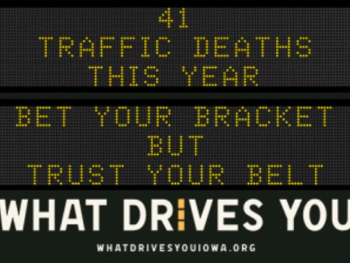 Traffic roadside graphic with text of the news article title.