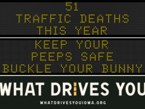 Traffic roadside graphic with text of the news article title.