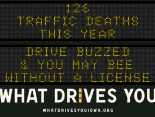Traffic roadside graphic with text of the news article title.