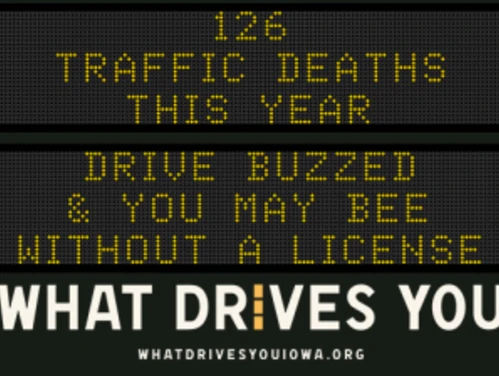 Traffic roadside graphic with text of the news article title.
