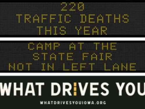 Traffic roadside graphic with text of the news article title.