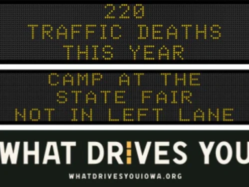 Traffic roadside graphic with text of the news article title.