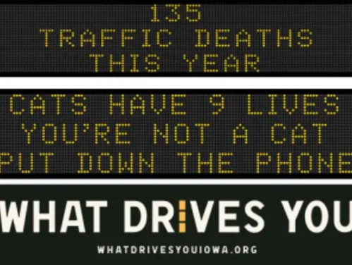 Traffic roadside graphic with text of the news article title.