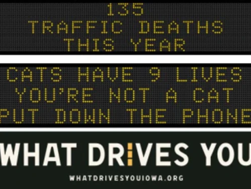 Traffic roadside graphic with text of the news article title.