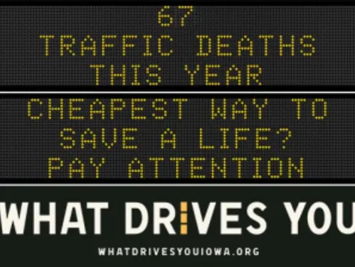 Traffic roadside graphic with text of the news article title.