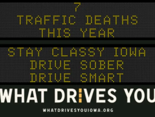 Traffic roadside graphic with text of the news article title.