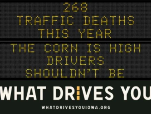 Traffic roadside graphic with text of the news article title.
