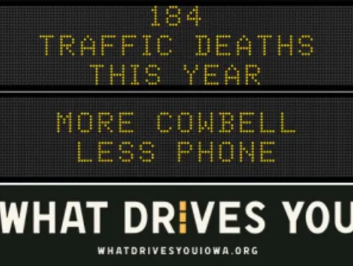 Traffic roadside graphic with text of the news article title.