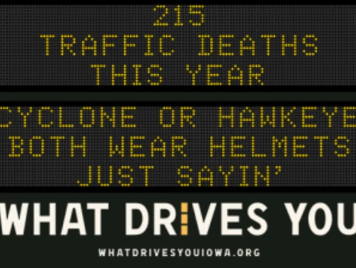 Traffic roadside graphic with text of the news article title.