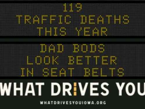 Traffic roadside graphic with text of the news article title.