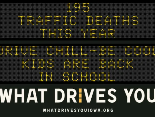 Traffic roadside graphic with text of the news article title.