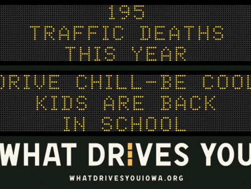 Traffic roadside graphic with text of the news article title.