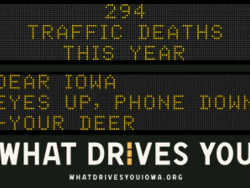 Traffic roadside graphic with text of the news article title.