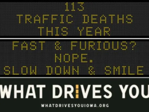 Traffic roadside graphic with text of the news article title.