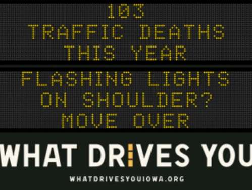 Traffic roadside graphic with text of the news article title.