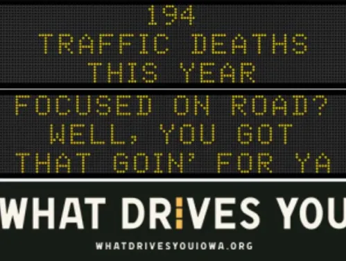 Traffic roadside graphic with text of the news article title.