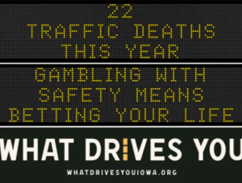 Traffic roadside graphic with text of the news article title.