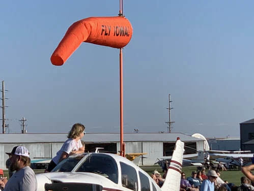 An orange windsock at an Iowa airport