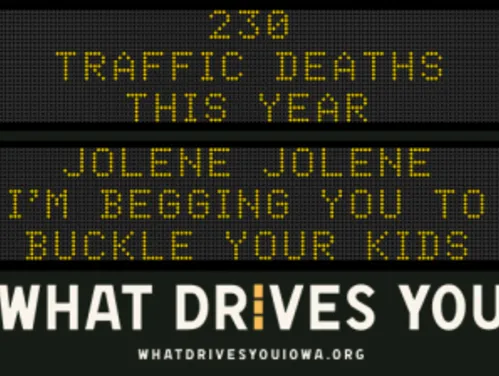 Traffic roadside graphic with text of the news article title.
