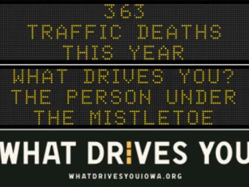 Traffic roadside graphic with text of the news article title.