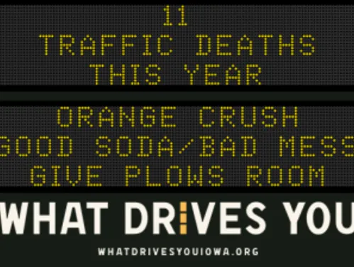 Traffic roadside graphic with text of the news article title.