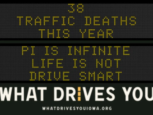 Traffic roadside graphic with text of the news article title.
