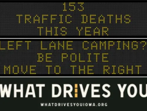 Traffic roadside graphic with text of the news article title.