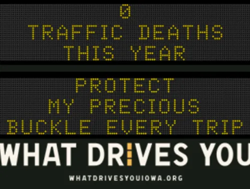 Traffic roadside graphic with text of the news article title.