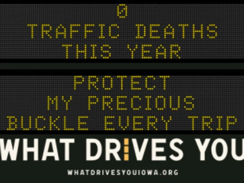 Traffic roadside graphic with text of the news article title.