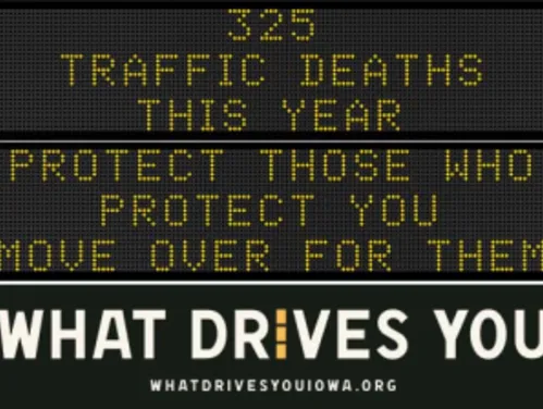 Traffic roadside graphic with text of the news article title.