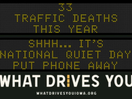 Traffic roadside graphic with text of the news article title.