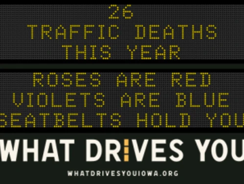 Traffic roadside graphic with text of the news article title.