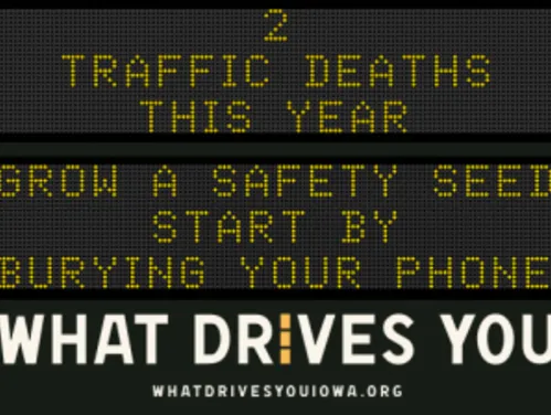 Traffic roadside graphic with text of the news article title.