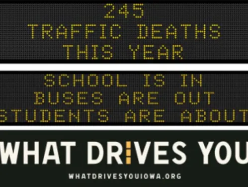 Traffic roadside graphic with text of the news article title.
