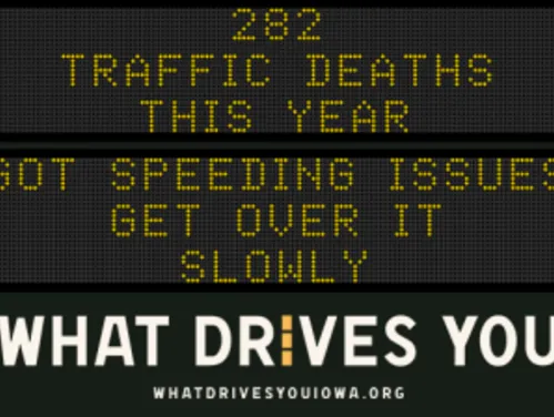 Traffic roadside graphic with text of the news article title.
