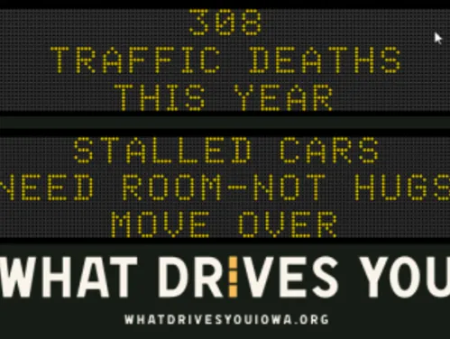 Traffic roadside graphic with text of the news article title.