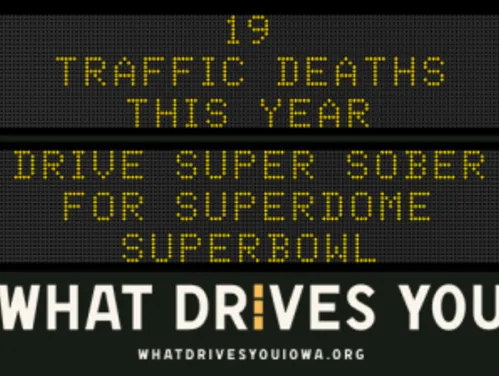 Traffic roadside graphic with text of the news article title.