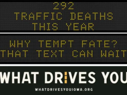Traffic roadside graphic with text of the news article title.