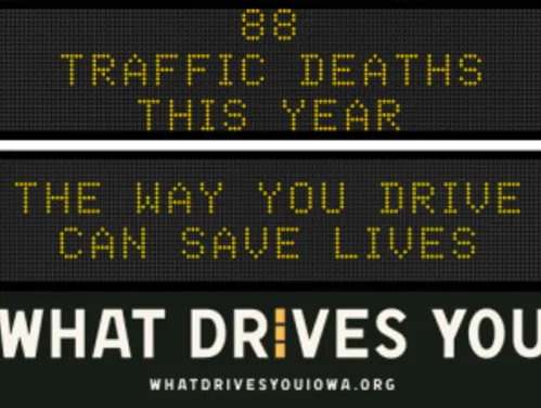 Traffic roadside graphic with text of the news article title.