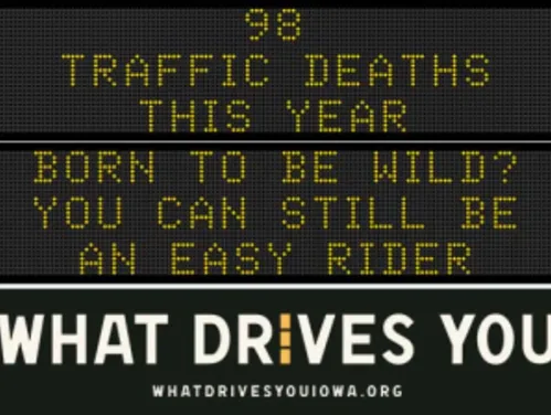 Traffic roadside graphic with text of the news article title.