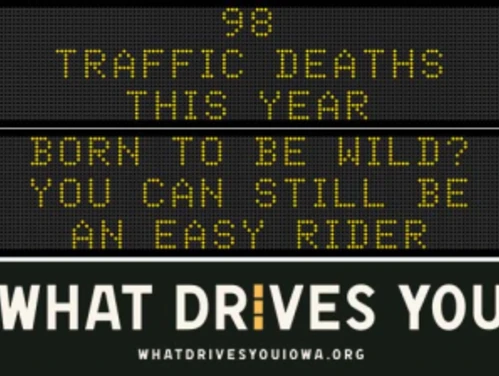 Traffic roadside graphic with text of the news article title.