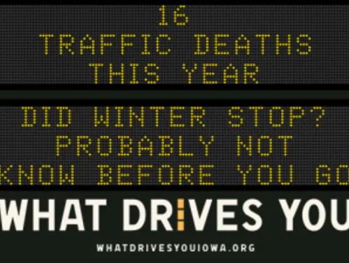Traffic roadside graphic with text of the news article title.