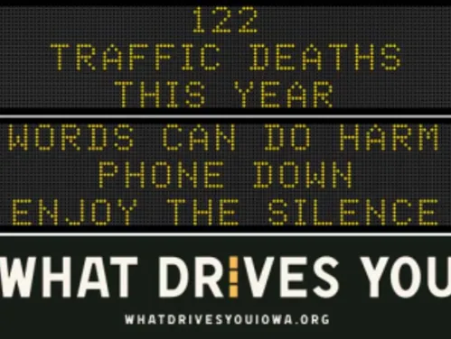 Traffic roadside graphic with text of the news article title.