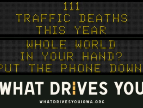 Traffic roadside graphic with text of the news article title.