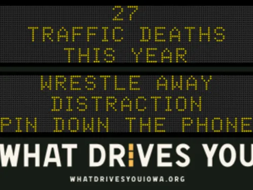 Traffic roadside graphic with text of the news article title.