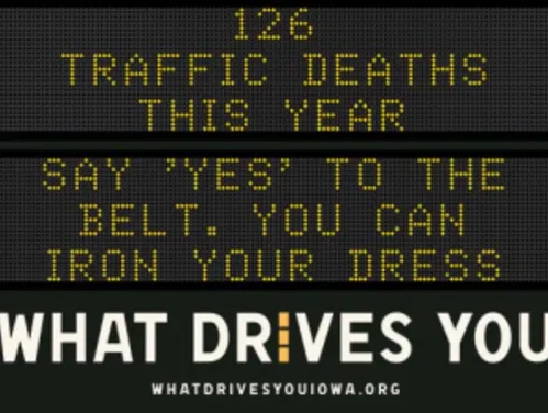 Traffic roadside graphic with text of the news article title.